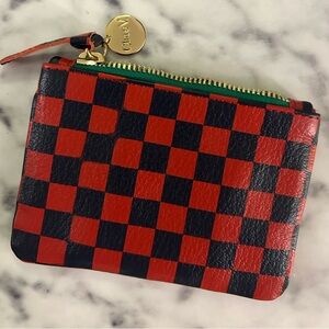 Clare V coin clutch in black and red checkers